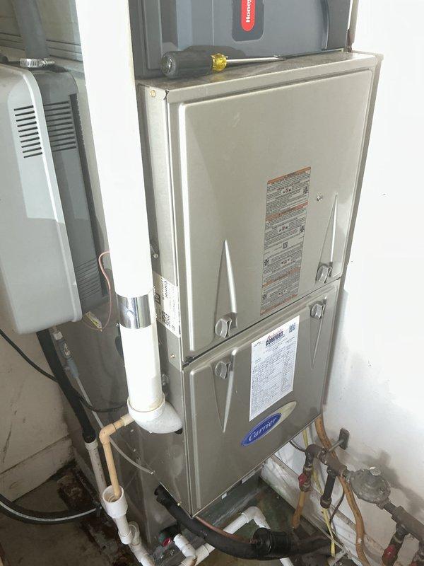 Completed comprehensive cooling maintenance on residential split system including outdoor condensing unit and indoor Carrier furnace. Performed standard preventive maintenance procedures per Basic Monthly service agreement: inspected outdoor unit on concrete pad, verified proper operation of condenser fan and compressor, checked refrigerant lines and electrical connections. Evaluated indoor air handler components, inspected ductwork connections and damper operation, verified proper drainage through PVC condensate lines. All equipment found operating within normal parameters with no deficiencies noted. System tested and confirmed cooling cycle functioning properly.