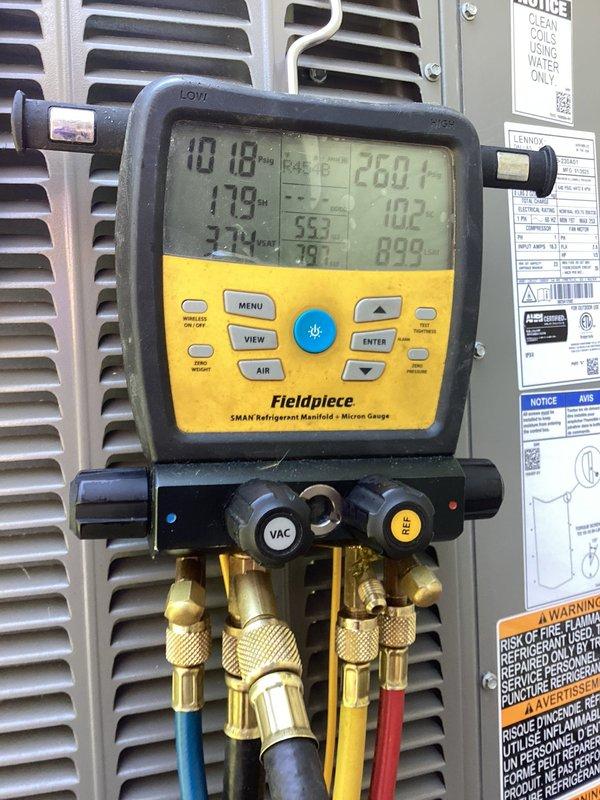 Returned to site with R-454B refrigerant to address refrigerant leak in outdoor condensing unit. Located and repaired leak in refrigerant line, then installed new filter drier to ensure system cleanliness. Evacuated system to proper micron level, recharged unit with R-454B refrigerant to manufacturer specifications, and verified all pressures and system operation were within normal parameters.
