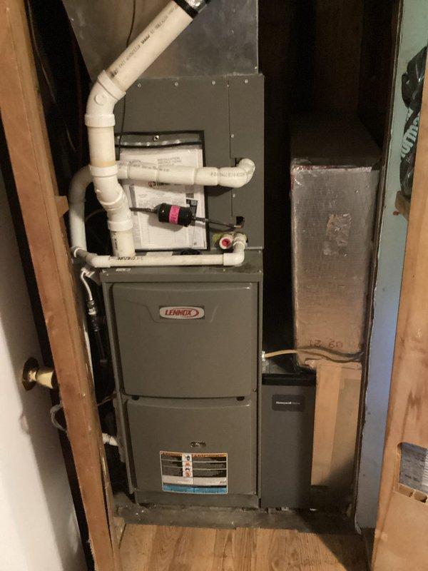 Completed routine HVAC maintenance and cooling system inspection on Lennox furnace unit. Noted that the comfort care coverage has expired and requires renewal, and standard 20x25x4 filter is not included with service. Verified thermostat operation displaying proper temperature reading of 72 degrees, inspected condensate line shut-off valves and PVC drainage system for proper function, and confirmed all system components and ductwork connections are secure and operating within normal parameters.