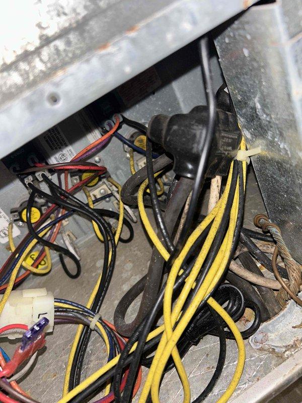 Completed basic monthly cooling maintenance visit on HVAC system. Performed visual inspection of electrical components and control wiring within unit housing, verifying proper connections and terminal integrity. Inspected and tested Honeywell programmable thermostat for proper operation and temperature control functionality, confirming system responds appropriately to thermostat commands.