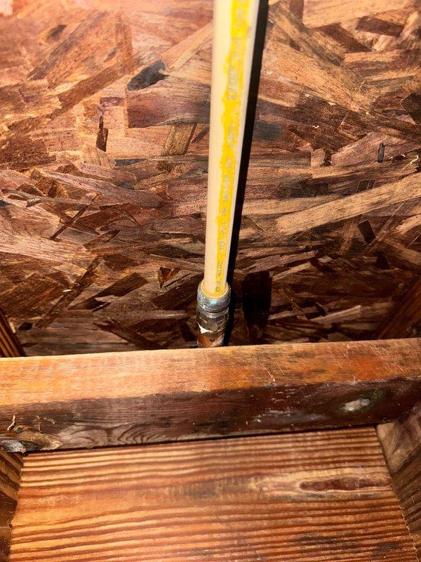 Responded to report of leaking exterior spigot. Accessed crawlspace to locate and inspect supply line serving the outdoor fixture. Identified leak at connection point behind exterior wall. Measured and documented the affected area for proper repair access. Applied repair to compromised connection, securing the joint with appropriate materials. Verified repair integrity and confirmed no active water leakage at spigot or supply line connection.