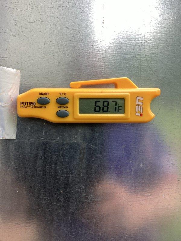 Performed routine HVAC maintenance and system evaluation. Verified thermostat operation showing heat and cool settings with indoor temperature reading of 67°F and setpoint range of 66-69°F. Confirmed system temperature readings using calibrated digital thermometer showing 66.1°F, validating proper thermostat accuracy and climate control functionality.