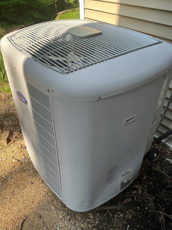 Completed monthly basic cooling maintenance visit on residential Carrier air conditioning system. Performed visual inspection of outdoor condenser unit, verified operational status, and checked thermostat programming showing system cooling from 77°F to setpoint of 68°F. Unit operating normally with no issues identified during this routine preventative maintenance service.