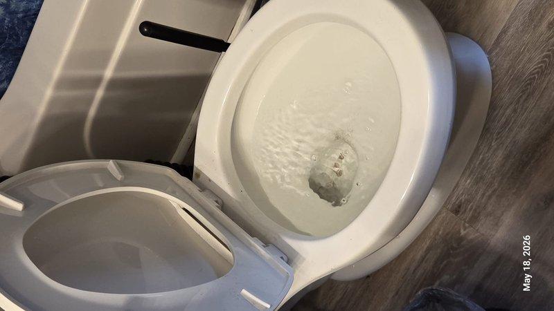 Responded to a multi-unit building experiencing recurring drainage issues affecting upper and lower apartments. Successfully cleared initial toilet obstruction in upper unit C, which re-clogged within 24 hours, with the lower unit subsequently developing a backup as well. Diagnosed issue as main sewer line obstruction affecting vertical stack serving both units, cleared blockage, and restored proper drainage to all affected fixtures.
