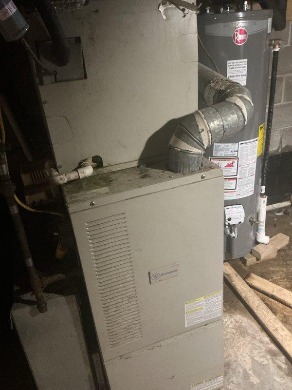 Completed annual spring maintenance inspection on residential HVAC system. Performed visual inspection of furnace unit and associated equipment in basement mechanical room, documented current system conditions with photographs, and noted filter size requires determination for future service visits.