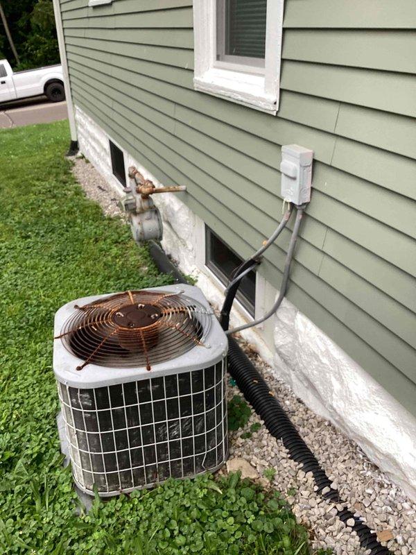 Responded to service call for non-operational air conditioning system under home warranty contract. Upon arrival, performed diagnostic inspection of outdoor condenser unit and indoor air handler. System evaluation completed with photographic documentation of equipment condition and installation configuration for warranty processing purposes.