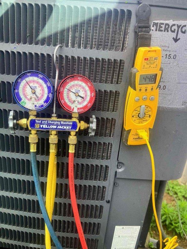 Responded to previously reported refrigerant leak on 7-year-old residential air conditioning system. Upon arrival, connected manifold gauge set to condenser unit and performed comprehensive pressure diagnostics on both high and low side refrigerant lines. Utilized digital multimeter to verify electrical parameters and confirm proper system operation. System currently maintaining cooling capacity despite reported leak from previous season, indicating slow leak rate. Documented refrigerant pressures and electrical readings for baseline comparison and future reference.