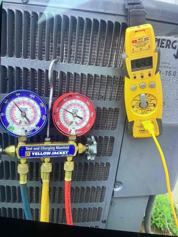 Responded to previously reported refrigerant leak on 7-year-old residential air conditioning system. Upon arrival, connected manifold gauge set to condenser unit and performed comprehensive pressure diagnostics on both high and low side refrigerant lines. Utilized digital multimeter to verify electrical parameters and confirm proper system operation. System currently maintaining cooling capacity despite reported leak from previous season, indicating slow leak rate. Documented refrigerant pressures and electrical readings for baseline comparison and future reference.