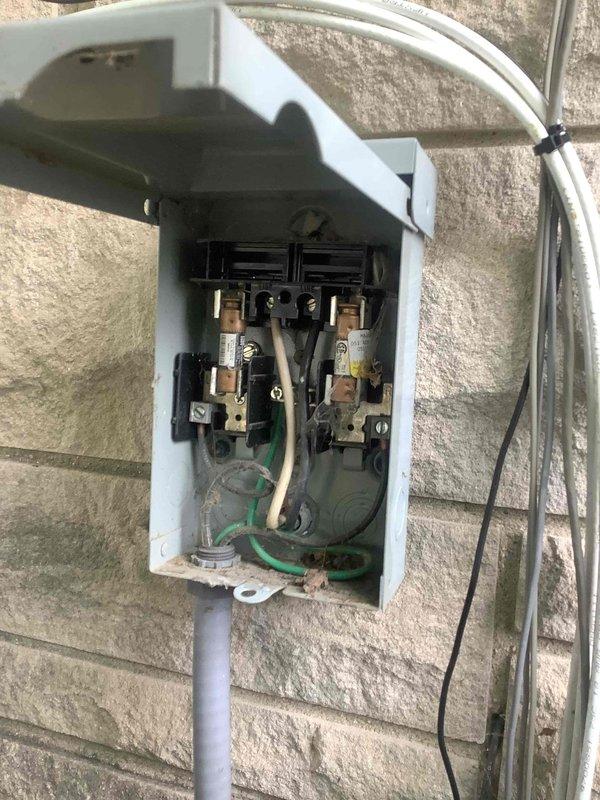 Responded to intermittent A/C operation complaint. Inspected outdoor unit and electrical disconnect, finding cartridge fuses and electrical connections at exterior disconnect box. Performed diagnostic testing with multimeter to verify electrical supply and component operation, documenting equipment nameplate data and measuring system parameters to identify cause of intermittent cycling issue.
