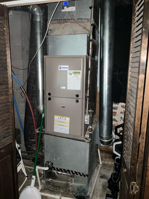 Conducted HVAC system evaluation for equipment replacement in residential basement utility area. The existing air conditioning unit from 2005 had been non-operational for approximately one year and was already removed from the property to allow for construction of properly sized equipment pad. Assessed current furnace installation and existing ductwork configuration, including supply and return plenum connections. Documented mechanical room layout with water heater, Guardian system components, and existing ventilation infrastructure. Measured available space and evaluated electrical service capacity for new equipment installation. Prepared two replacement options: complete HVAC system replacement including both furnace and air conditioning unit, and air conditioning unit replacement only, with proper equipment sizing calculations to address concerns about previous unit capacity.