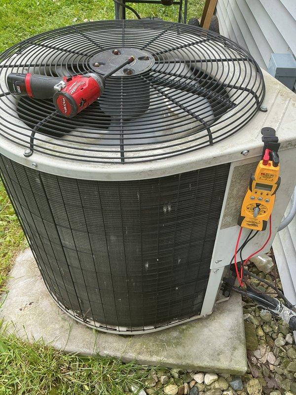 Completed comprehensive AC tune-up on residential cooling system. Performed electrical diagnostics on outdoor condenser unit using digital multimeter to verify proper voltage and amperage levels. Noted thermostat displaying clean filter reminder; advised customer on filter maintenance schedule to ensure optimal system performance and efficiency.