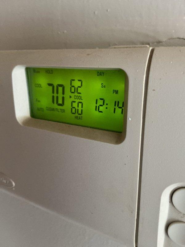 Completed comprehensive AC tune-up on residential cooling system. Performed electrical diagnostics on outdoor condenser unit using digital multimeter to verify proper voltage and amperage levels. Noted thermostat displaying clean filter reminder; advised customer on filter maintenance schedule to ensure optimal system performance and efficiency.