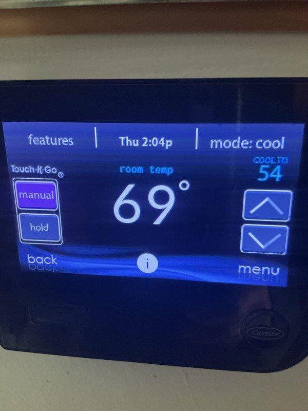 Completed annual spring tune-up on Carrier HVAC system. Homeowner reported error code over the weekend, but system was operating normally upon arrival with no active faults. Performed comprehensive inspection of indoor and outdoor units, verified thermostat operation at 69°F with cooling setpoint of 54°F, and confirmed proper system performance with adequate cooling capacity. Outdoor condenser unit showed no visible damage with clean coils and intact refrigerant lines. System operating within normal parameters with no issues found.