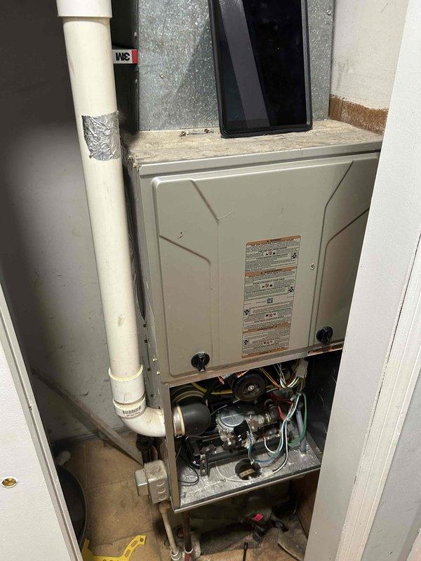 Performed second opinion inspection on 9-year-old furnace system following report of cracked heat exchanger from another contractor. Conducted thorough visual examination of heat exchanger assembly with access panels removed, inspecting all surfaces for cracks, corrosion, or structural damage. Utilized diagnostic equipment to assess unit operation and verify heat exchanger integrity. Found no evidence of cracked heat exchanger upon detailed inspection of internal components. Documented findings with photographic evidence showing heat exchanger condition, internal mechanical components, refrigerant lines, and electrical connections all in serviceable condition.
