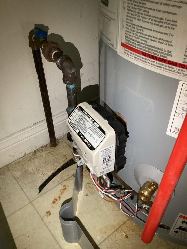 Responded to no hot water complaint on tanked water heater installed in February 2023. Upon arrival, inspected gas control valve and ignition system as previous service visit had noted potential gas valve failure. Verified pilot light was extinguished and attempted relight procedure. Observed burner ignition and confirmed flame established properly through viewing window. Tested gas valve operation and combustion chamber for proper function. Inspected copper supply lines, shut-off valves, and connections for any signs of leaks or corrosion. Documented control module and burner assembly condition with photos. System restored to full operation with hot water production confirmed. Advised that gas valve replacement may still be necessary if issue recurs given unit's service history.