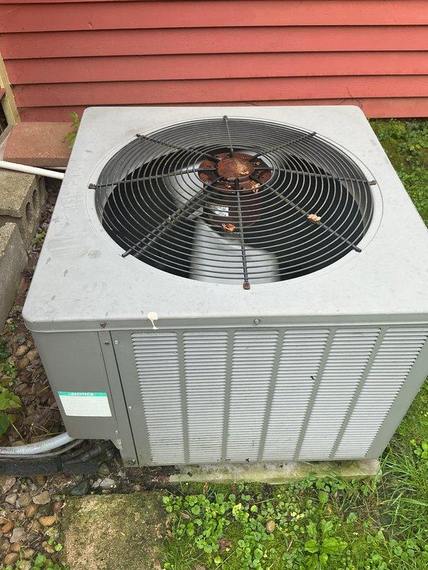 Completed basic monthly cooling maintenance service including system inspection and filter replacement. Inspected outdoor condenser unit, confirmed proper operation of fan motor and compressor, and verified adequate airflow through coil louvers. Replaced air filter with clean pleated media filter and documented equipment condition with photographs for service records.