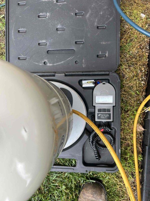 Returned to residential property to complete repair work on air conditioning system. Replaced faulty thermostatic expansion valve (TXV) and repaired refrigerant leak. Connected manifold gauges to service ports on outdoor condenser unit to verify system pressures and confirm proper refrigerant charge after repairs. System tested and operating within manufacturer specifications upon completion.