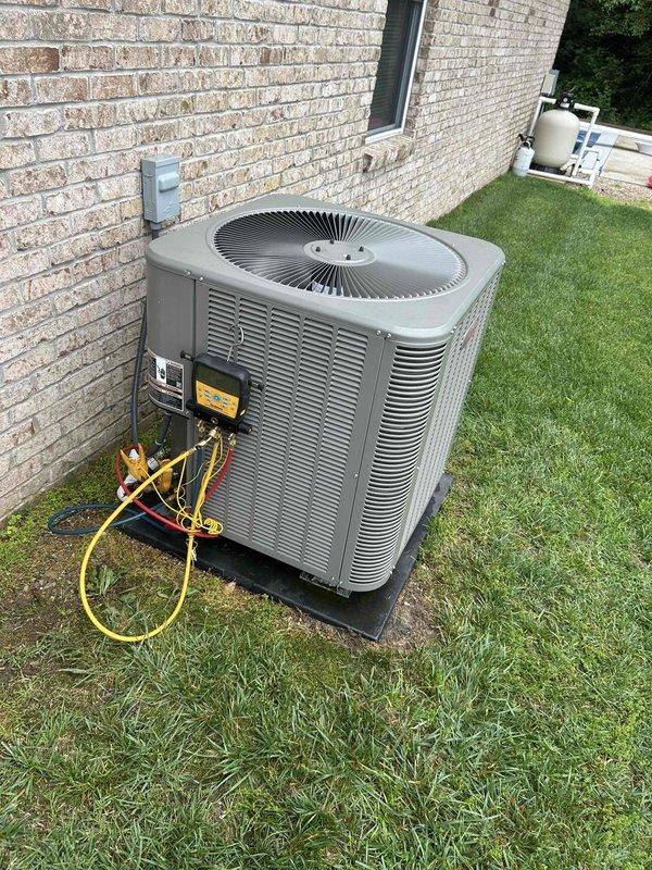 Returned to residential property to complete repair work on air conditioning system. Replaced faulty thermostatic expansion valve (TXV) and repaired refrigerant leak. Connected manifold gauges to service ports on outdoor condenser unit to verify system pressures and confirm proper refrigerant charge after repairs. System tested and operating within manufacturer specifications upon completion.