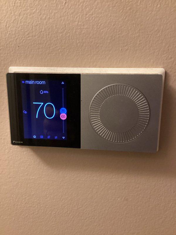 Completed monthly maintenance visit for cooling system under membership agreement. Performed standard preventive maintenance procedures on vertical air handler unit, replaced 20x20x4 air filter, and verified proper operation of Daikin smart thermostat displaying 70°F setpoint with 65% humidity reading. All refrigerant lines, safety labels, and system components inspected and found in good working order.