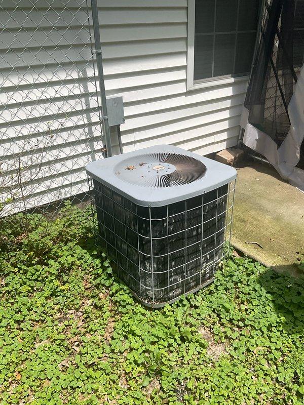 Conducted site evaluation for complete HVAC system replacement at residential property. Existing outdoor condenser unit showing significant age-related deterioration including rust staining on top panel, weathering, and dirt accumulation on protective grilles. Customer reported air conditioning system no longer operational after three years of ongoing maintenance issues. Documented current equipment condition with photographs showing unit positioned against exterior wall on concrete pad with adequate clearance. Prepared comprehensive replacement estimate for new HVAC system installation to restore climate control functionality.