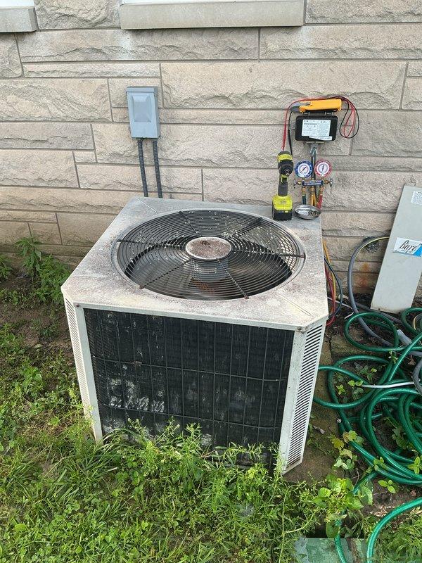 # HVAC Maintenance - Cooling System Service

Performed comprehensive basic monthly cooling maintenance on residential air conditioning system. Conducted thorough inspection of outdoor condenser unit, including visual assessment of cabinet condition, fan operation, and mounting stability. Opened electrical disconnect panel to inspect internal wiring connections, capacitor condition, and component integrity. 

Utilized digital manifold gauge set to measure and record system operating pressures and temperatures. Connected diagnostic equipment to verify refrigerant charge levels and system performance parameters. Inspected electrical connections at capacitor, noting multiple wire terminations for compressor and fan motor circuits. Verified proper operation of condenser fan motor and assessed airflow through protective mesh guard.

Examined condenser coil fins for debris accumulation and damage. Assessed overall unit cleanliness and environmental conditions around installation site. Verifie