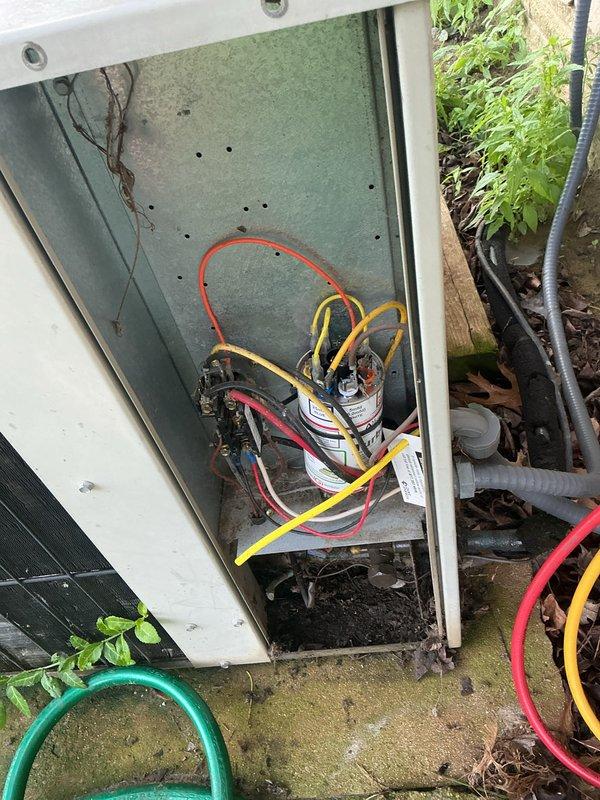 # HVAC Maintenance - Cooling System Service

Performed comprehensive basic monthly cooling maintenance on residential air conditioning system. Conducted thorough inspection of outdoor condenser unit, including visual assessment of cabinet condition, fan operation, and mounting stability. Opened electrical disconnect panel to inspect internal wiring connections, capacitor condition, and component integrity. 

Utilized digital manifold gauge set to measure and record system operating pressures and temperatures. Connected diagnostic equipment to verify refrigerant charge levels and system performance parameters. Inspected electrical connections at capacitor, noting multiple wire terminations for compressor and fan motor circuits. Verified proper operation of condenser fan motor and assessed airflow through protective mesh guard.

Examined condenser coil fins for debris accumulation and damage. Assessed overall unit cleanliness and environmental conditions around installation site. Verifie