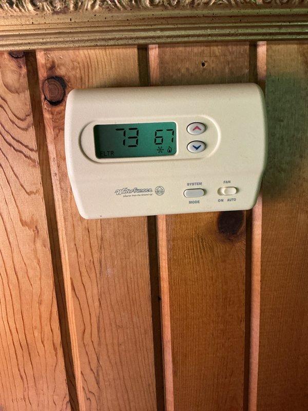 Completed basic monthly cooling maintenance on residential HVAC system. Inspected evaporator coil and air handler unit, verified thermostat operation showing 73°F ambient and 67°F setpoint in cooling mode, and checked system controls and wiring connections. Filter size 23 7/8 x 30 7/8 was not included in this service and will need to be provided separately for replacement.