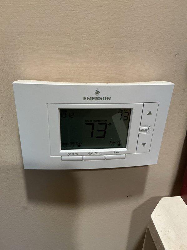 Completed comprehensive cooling system maintenance inspection per basic preventative maintenance agreement. Verified thermostat operation showing 73°F with system in auto mode, confirmed proper temperature control and display functionality. Documented equipment conditions including water heater installation with visible hot and cold water connections. Customer informed that 20x20x4 filter is not included in service agreement and must be provided separately for future maintenance visits.