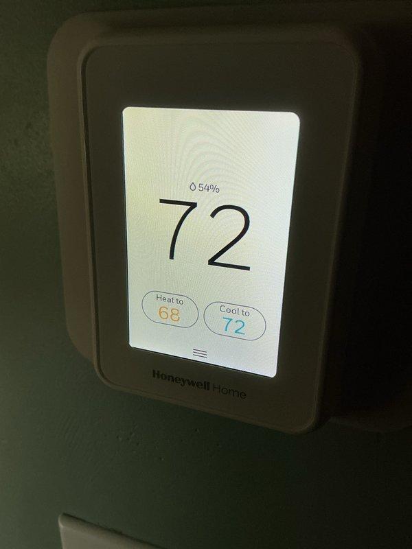 Completed basic monthly cooling maintenance on residential HVAC system. Inspected furnace unit with refrigerant lines and PVC venting, verified Honeywell Home thermostat operation showing 72°F cooling setpoint with proper system response. System operating within normal parameters; customer advised that 20x25x4 filter not included in maintenance agreement.