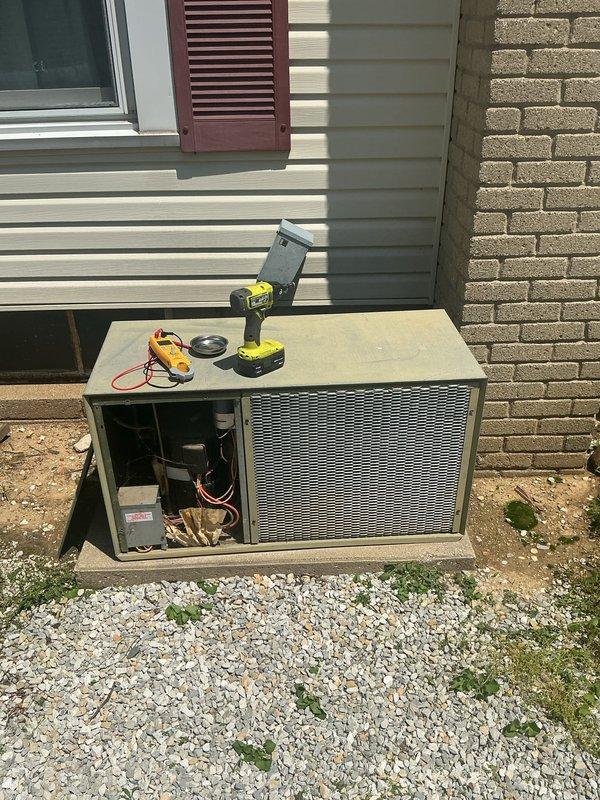 Completed basic monthly cooling maintenance visit on residential HVAC system. Performed standard inspection of outdoor condensing unit with access panel opened to evaluate compressor, electrical connections, and internal components; all operating parameters found within normal range. Interior inspection confirmed water heater and associated plumbing connections in satisfactory condition with no immediate service requirements noted.