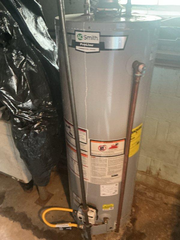 Completed basic monthly cooling maintenance visit on residential HVAC system. Performed standard inspection of outdoor condensing unit with access panel opened to evaluate compressor, electrical connections, and internal components; all operating parameters found within normal range. Interior inspection confirmed water heater and associated plumbing connections in satisfactory condition with no immediate service requirements noted.