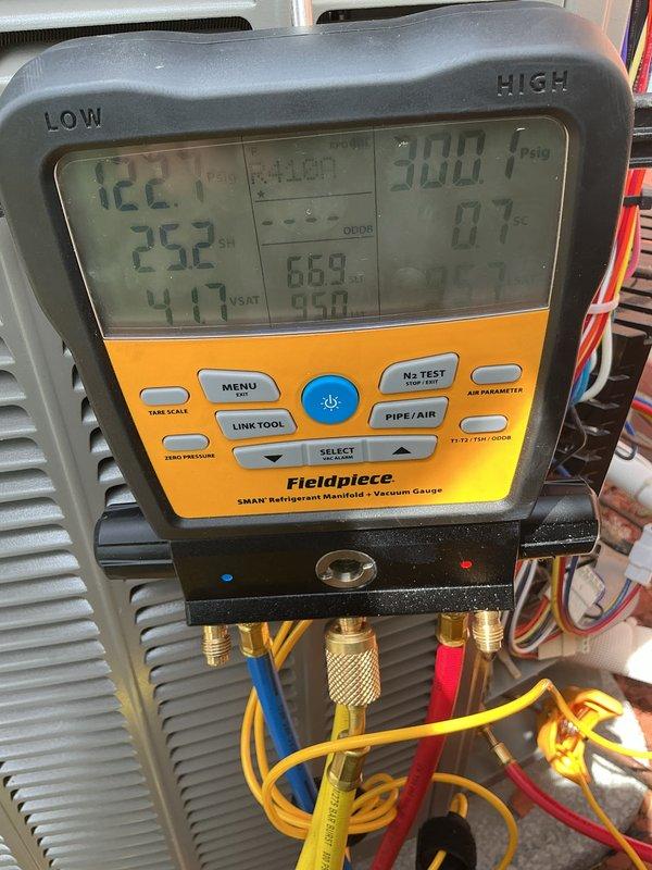 # HVAC Maintenance - Cooling System Service

Completed comprehensive cooling maintenance service on residential HVAC system. Performed system diagnostics using Fieldpiece SMAN4 refrigerant manifold and vacuum gauge to assess refrigerant pressures and temperatures. Recorded operating pressures with low side reading 122.1°F and high side reading 252°F, with system pressures measuring 669 PSI and 900 PSI respectively. Monitored superheat and saturation values to verify proper refrigerant charge and system performance.

Replaced 20x20x4 air filter as part of scheduled maintenance protocol. Updated equipment maintenance and repair history documentation mounted on unit, ensuring accurate service records for future reference. All system parameters verified within acceptable operating ranges. Unit operating properly upon completion of service.