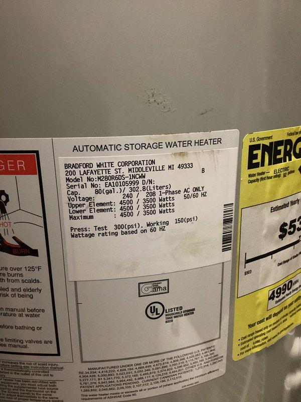 Responded to water heater leak complaint and performed thorough inspection of Bradford White 80-gallon residential unit installed in 2008. Upon examination, documented the water heater's current condition, specifications, and installation setup including copper supply lines and venting system. Photographed unit identification labels showing model M2B0R6DS-1NCWW with serial number EA10105999, rated at 4500/3500 watts with 150 psi maximum working pressure. Assessed the overall system integrity and documented findings for repair recommendations.