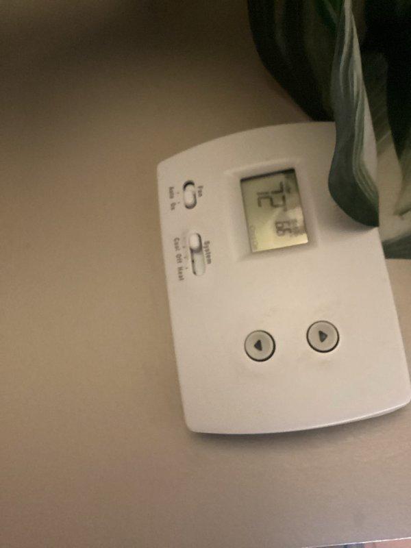 Responded to no-cooling complaint on residential air conditioning system. Upon arrival, found thermostat displaying 74 degrees but system not operating. Performed diagnostic evaluation of HVAC equipment and identified failed components in aging system with visible corrosion on heat exchanger assembly and ductwork connections. Documented equipment condition showing extensive rust on metal brackets, clamps, and connection points indicating prolonged moisture exposure. Advised customer of findings and provided recommendations for necessary repairs to restore cooling operation.