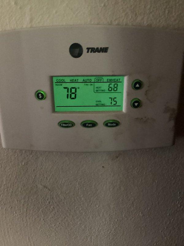 Responded to callback for system not cooling following previous frozen evaporator coil issue. Upon arrival, verified thermostat set to cooling mode at 75°F with current room temperature reading 78°F. Confirmed system had thawed from previous freeze-up condition but was no longer providing adequate cooling. Inspected Trane thermostat operation and settings, documented current system status with photos showing display readings and mode selections.