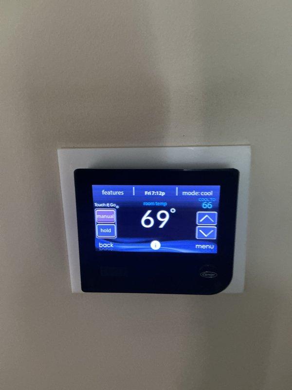 Completed annual HVAC maintenance service on residential heating system. Performed comprehensive inspection of furnace unit including blower motor assembly, electrical components, control board, and all internal mechanical systems. Verified Carrier thermostat operation showing proper temperature control functionality in cooling mode with system maintaining setpoint parameters. All equipment found operating within normal specifications with no deficiencies noted.