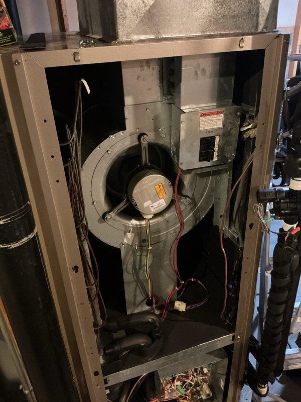 Completed annual HVAC maintenance service on residential heating system. Performed comprehensive inspection of furnace unit including blower motor assembly, electrical components, control board, and all internal mechanical systems. Verified Carrier thermostat operation showing proper temperature control functionality in cooling mode with system maintaining setpoint parameters. All equipment found operating within normal specifications with no deficiencies noted.