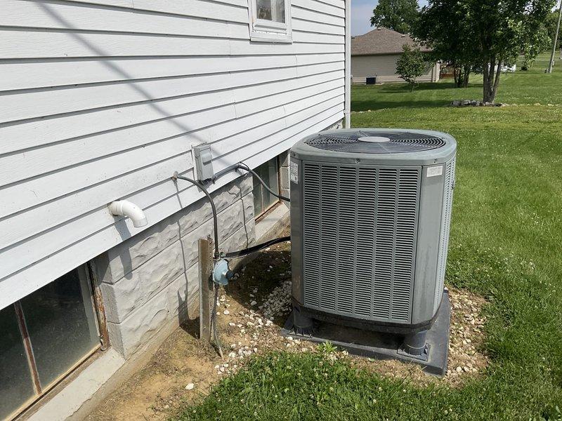 Performed comfort consultation and full system replacement estimate for 16-year-old Trane heat pump with propane furnace backup. Existing system diagnosed with failed thermal expansion valve (TXV), prompting homeowner's request for complete replacement options. Documented outdoor condensing unit and indoor air handler/furnace configuration, assessed current installation including refrigerant line routing, ductwork connections, electrical service, and equipment placement in basement mechanical room.