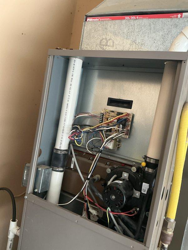 Completed comprehensive tune-up service on residential HVAC system including both heating and cooling components. Performed standard maintenance procedures on air handler unit, inspected blower motor assembly, electrical connections, and control board, replaced air filter with new Filtrete unit, and verified proper operation of Sensi programmable thermostat displaying correct temperature readings and system functionality.