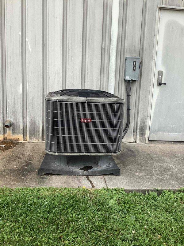 Responded to no-cooling complaint for front office air conditioning system. Upon arrival, found Honeywell programmable thermostat displaying system in cooling mode with indoor temperature at 76°F and setpoint at 72°F, outdoor temperature reading 94°F. Inspected outdoor condensing unit and verified equipment operation, checked electrical connections at disconnect box, and confirmed unit cycling properly. System restored to normal operation.