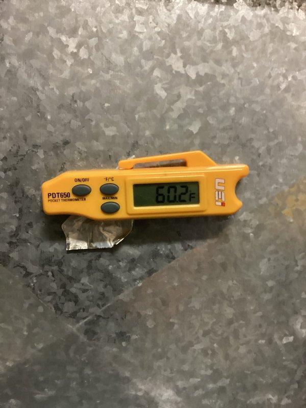 Responded to pressure error alert on residential air conditioning system. Upon arrival, found unit displaying yellow warning triangle indicating system pressure fault and non-operational status. Performed diagnostic assessment of outdoor condensing unit, which revealed heavily soiled condenser coils with significant accumulation of dirt, debris, and organic material restricting airflow. Documented ambient temperature readings and current system conditions. Condenser fins showed dark discoloration from extended exposure and lack of maintenance cleaning. Recommended thorough coil cleaning and complete system pressure testing to restore proper operation and resolve error condition.