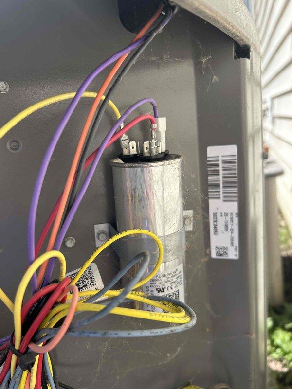 Responded to residential service call for flashing red indicator light on 2-year-old cooling system after filter replacement. Performed diagnostic evaluation of outdoor condensing unit and electrical components. Utilized digital multimeter to test voltage and capacitance readings at control board terminals and run capacitor. Inspected capacitor for proper operation, verified wire connections at terminal blocks, and assessed overall electrical integrity of the system. System operational upon completion of diagnostic testing.