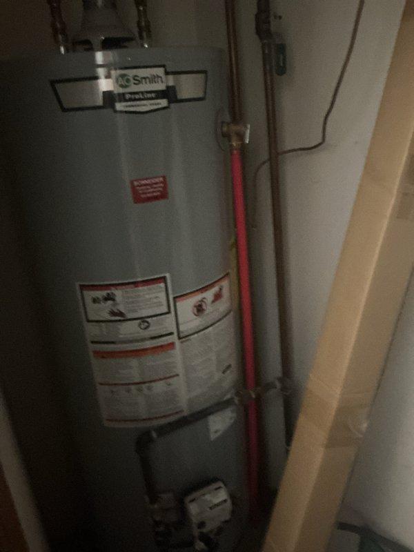 Completed monthly basic cooling maintenance visit on residential HVAC system. Performed standard inspection of Carrier air handler unit and associated components, verified proper operation of cooling equipment, and documented system condition with photographs showing water heater and furnace installations in mechanical room.