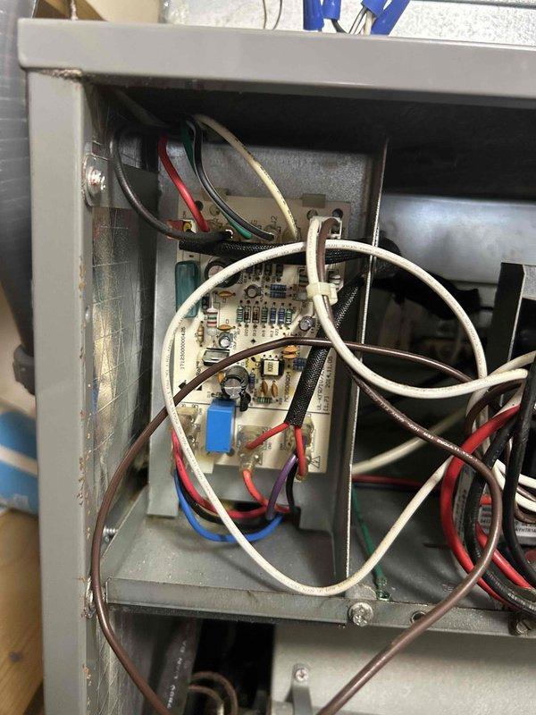 Responded to residential no airflow complaint on air handler unit. Upon arrival, performed diagnostic inspection of indoor HVAC system. Removed access panel to evaluate internal components including blower assembly, control board, and electrical connections. Inspected circuit board, capacitor, wiring harness, and breaker panel within upper control compartment. Examined blower motor assembly and UV light system in lower chamber. All electrical connections verified secure with proper wire routing throughout control panel. System components found in operational condition with no visible damage to circuit board or capacitor. Airflow issue resolved and unit returned to normal operation.