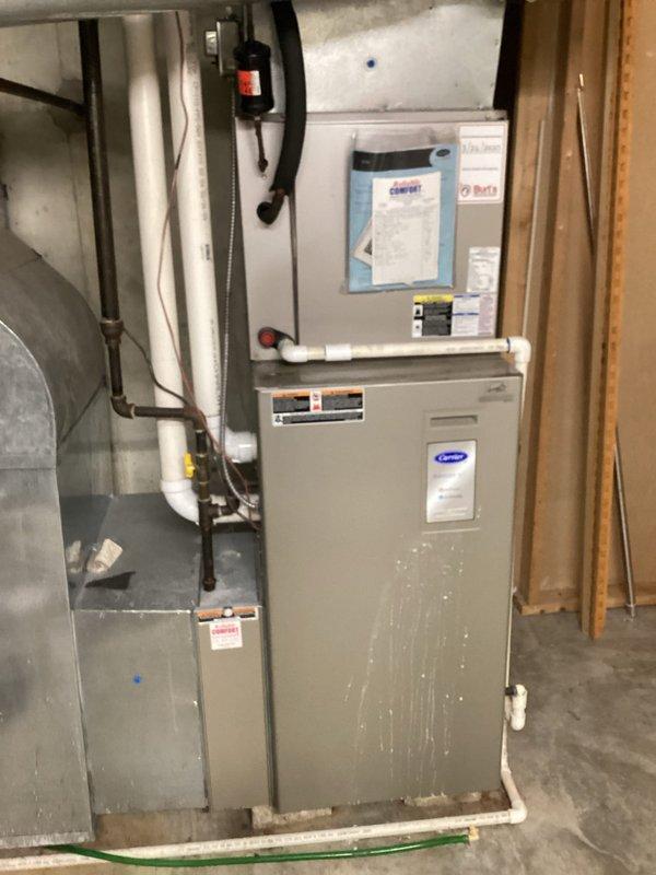 Responded to service call for air conditioning system experiencing frost buildup on evaporator coil. Upon arrival, customer had already shut down system to allow for defrost as advised. Performed visual inspection of Carrier HVAC system and identified severely restricted airflow due to heavily clogged air filter, which was causing the coil to freeze. Replaced dirty air filter with new unit and verified proper system operation after thaw cycle completed. Monitored refrigerant pressures and confirmed no refrigerant leak present; freezing issue was solely attributed to inadequate airflow from blocked filter restricting heat exchange at evaporator coil.