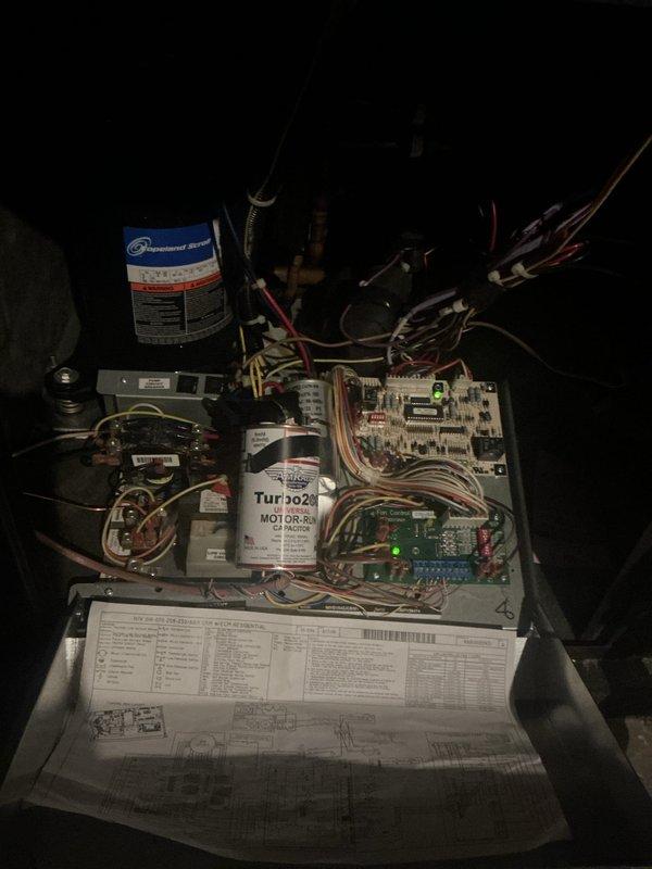 # HVAC Maintenance - Cooling System Service

Completed basic monthly cooling maintenance visit on residential HVAC system. Performed comprehensive inspection of all major components including capacitor, motor assembly (Turbo 302 MOTOR-RX), control boards, and electrical connections. Verified proper operation of thermostat displaying 70°F actual temperature with system controls functioning correctly. All wiring harnesses, circuit boards with illuminated LED indicators, and electrical components inspected and found in satisfactory working condition with no immediate repairs required.