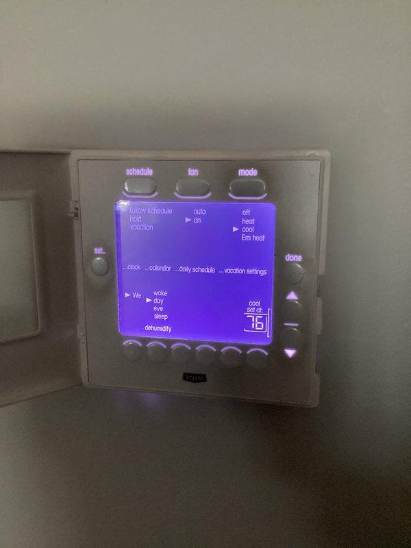 Performed diagnostic evaluation on geothermal heat pump system experiencing inadequate heating capacity during winter months, resulting in frequent auxiliary electric resistance heat operation. Inspected ground loop pressure gauge readings, piping connections, and turquoise-insulated ground loop supply/return lines. Reviewed thermostat programming and system operation settings on digital control interface. Discussed customer request for converting auxiliary heating system from electric resistance to natural gas backup heat and provided consultation on conversion requirements and equipment options for future consideration.