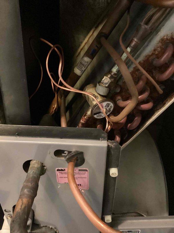 Replaced failed thermostatic expansion valve (TXV) on HVAC system and applied leak sealant to refrigerant circuit. Verified proper system pressures, superheat, and subcooling readings using refrigerant manifold gauges following component replacement and system recharge.