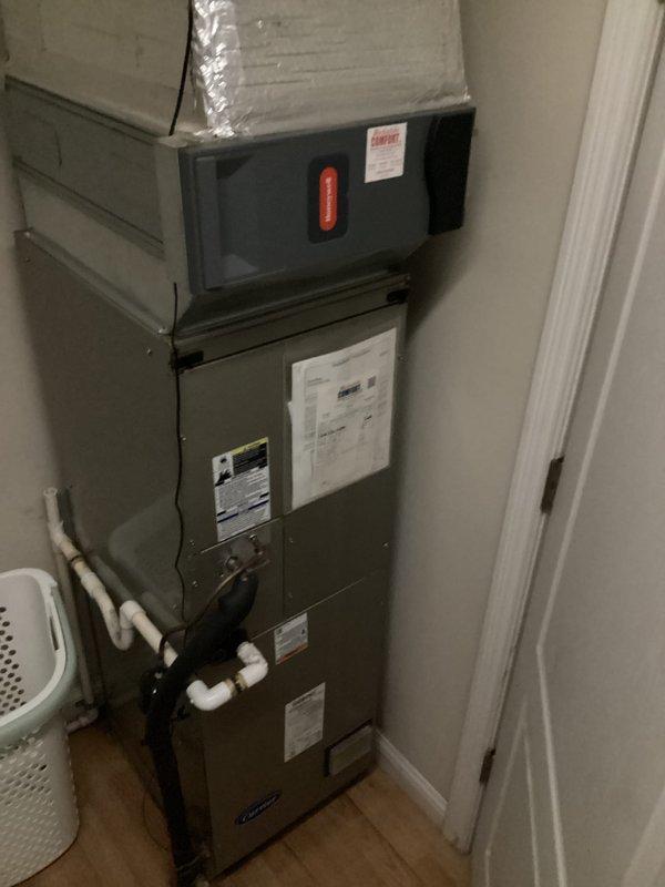 Completed monthly basic cooling maintenance visit on residential heat pump system. Performed standard inspection of stacked HVAC configuration including furnace, air handler, and associated components. Verified thermostat operation showing system maintaining 72°F setpoint in cooling mode with fan set to auto. Checked condensate drain lines and PVC piping connections for proper operation. System operating within normal parameters at time of service.
