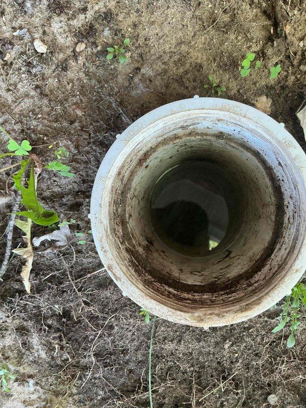 Responded to clogged drain service call and performed diagnostic inspection of the main sewer line. Upon investigation, identified root intrusion as the primary cause of the blockage. Accessed the cleanout opening and documented the condition of the drainage system, revealing significant root penetration within the pipe structure. The trip fee was credited toward the necessary repair work to address the root infiltration issue and restore proper drainage function.